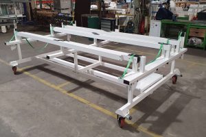Custom-built trolley with telescopic extensions and spreader system