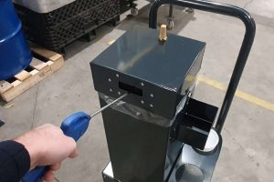 Custom-built trolley for cleaning machine nozzles